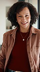 Face, woman and laugh in living room with funny joke, relax and wellness on peaceful weekend break. Mature, African person and happy in home with humor, positive attitude and good mood for calm day.