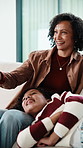 Mother, child and watching tv on sofa with remote, bonding together and conversation for funny film. Mom, daughter talk and  laugh in home for comedy show, change channel and relax for entertainment.