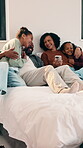 Family, laughing and bonding with children in bedroom, embrace or discussion with parents on weekend. Happy, African people and hug with kids on bed, home and relax together with phone on break