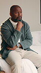 Serious, thinking and black man with stress in bedroom for emotional burden, pressure or anxiety. Mental health, mature person and overthinking in home for distressing news, reflection or overwhelmed