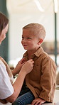 Smile, mother and dressing child at house with love, morning routine and back to school. Woman, helping and son with outfit change, getting ready and neat appearance with encouragement for preschool