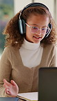 Girl, student and wave with headphones for video call, online lesson or virtual classroom in home. Child, kid or talking with glasses or laptop for education, elearning or communication in house