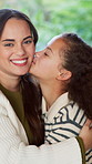 Cheek kiss, mom or girl in house with face, family hug or bonding together for child growth. Love, smile or kid with portrait, healthy relationship or parent connection for childhood development.