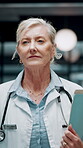 Doctor, walk and woman with file in hospital, wellness and info for patient history or test results. Clinic, medical professional and mature person with folder for healthcare service and diagnosis