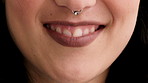 Mouth, closeup and woman with smile for nose ring, skin and pride with metal bar for style expression. Person, steel jewelry and beauty with septum piercing, gemstone or lipstick with body art