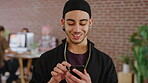 Phone, happy and man in creative college for online, internet or communication with about us information. Typing, smile and graphic designer student for tech results, update or schedule on campus app