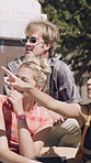 Talking, friends and group in city with happy, pointing and showing location for student abroad. Excited, outdoor and people on campus for sharing information, helping or conversation of new college