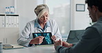 Tablet screen, xray and doctor with man in hospital for treatment plan, healthcare or explaining. Digital technology, consultation and medical worker with male patient for radiology scan in clinic.