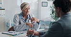 Healthcare, doctor or discussion with man in clinic for medical results, treatment options or help. Checkup, mature professional or consulting patient for health feedback, diagnosis or follow up care