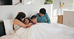 Happy family, playing and bed with children in home for fun holiday, weekend or bonding together. Mom, dad and tickle with kids or duvet sheet in bedroom for laugh, humor or funny childhood in house