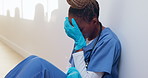 Tired, nurse and thinking with black woman in hospital for medical burnout, stress and risk. Healthcare mistake, reflection and challenge with frustrated person on floor of clinic for fatigue