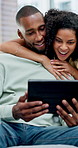 African couple, hug and chat with tablet for social media, meme or bonding in living room of home. Man, woman and relax with smile on tech for communication, embrace and love on sofa for gossip story