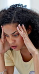 Frustrated, woman and headache with stress for financial crisis, discomfort or anger in home. Furious, female person or anxiety with mental health or pressure for conflict, fight or anger in house