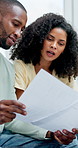 Couple, documents and budget in home with discussion, planning and asset management in living room. African people, partner and paperwork with financial review, bills and tax compliance at apartment