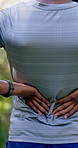 Man, fitness and nature with back pain for outdoor injury, accident or muscle tension. Active, male person or sore spine with discomfort, inflammation or fibromyalgia for workout strain or pressure