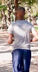 Running, back and couple with fitness in park, summer training and cardio challenge for wellness. Outdoor, active and people with aerobic exercise for endurance development, jog and practice together