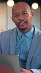 Businessman, discussion or consultation in office with laptop, listen or advice for insurance agency. Person, conversation or feedback in meeting with computer, gap cover, financial service or policy