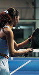 Fitness, serving and woman with padel racket for game, training and exercise for sports competition. Tennis court, technique practice and player with equipment for match, weekend contest and active