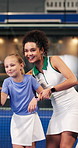 Padel, trainer and child on court for learning to swing, serve and skill for game, practice or sports. Fitness, tennis and coach with girl for lesson, exercise and training with racket for match