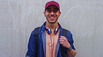 Face, man and happy with student outdoor for education, scholarship and study abroad. Wall, portrait or male person with mockup space, learning opportunity and positive attitude for college knowledge