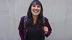 Face, woman and student with backpack outdoor for education, scholarship and study abroad. Wall, portrait and female person with mockup space, learning opportunity and laughing for college knowledge