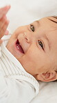 Happy, baby and boy clapping on bed with wellness, relax or healthy for early childhood development. Comfortable, innocent young child and laugh in home with applause, wonder or curiosity for growth.