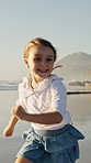 Running, fun or playing with girl on beach for summer holiday, vacation or outdoor weekend. Playful, child or kid with smile on ocean coast or sea for freedom, happy childhood or adventure in nature