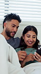 Cellphone, relax and couple on bed in home with funny meme, texting or social media on mobile app. Happy, laugh and man with woman on phone for chatting online together in apartment on weekend.