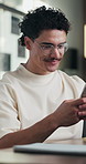 Man, phone and texting at office with smile for notification, contact and glasses at startup company. Person, happy and scroll with mobile app, break and social media management at digital agency