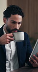 Business, coffee and man with tablet in office for stock market results, news or scroll. Happy, review and professional analyst with tea and tech for monitoring growth, report or company revenue