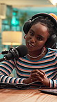 Podcast, headphones and woman with mic in studio, content creation or creative broadcast with laptop. Presenter, online and black person with tech for news announcement, live stream and storytelling