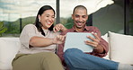 Happy, couple and laughing with tablet on sofa for funny entertainment, humor or comedy in home. Man, woman or joke with technology for fun interaction, game or bonding together on couch in house