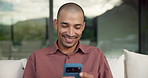 Relax, laugh and man with phone on couch for weekend, reading funny blog and watch social media video. Digital communication, joke and happy person with mobile for browsing internet, texting or home
