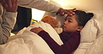 Night, dad and hand with sick child in bed for telehealth, advice or monitoring fever in home. Father, talking or checking kid with phone call or assistance for childcare, illness or virus in bedroom