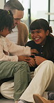 Tickle, love and laughing with family on sofa in home for bonding, support and funny games. Happiness, connection and playful with parents and children in living room of house for love and joke