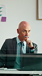 Thinking, mature and man in office on computer with business review, research or insurance. Solution, reflection and professional broker for risk evaluation, writing report and assessment with glass