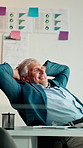 Businessman, relax and happy at office with complete project, break and stretching at investment company. Mature person, broker and advisor with relief, perspective and done with charts at agency