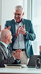 Laptop, clapping and people in meeting with mature manager for news, success or revenue. Excited, celebration and boss with business team and online results or achievement for company growth