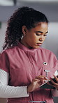 Woman, nurse and tablet in hospital for research, schedule update or healthcare information. Medical attendant, tech and scroll in clinic for telehealth platform, digital report or app for efficiency