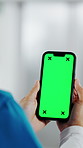 Hands, nurse and phone with green screen in hospital for research, medical report and mockup space. Person, ux or mobile display for telehealth, healthcare results and information on surgery schedule