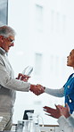 People, applause and handshake in hospital for award, achievement and healthcare services in office. Excited group, shaking hands and meeting for celebration, thank you and success trophy in clinic