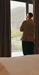Thinking, curtain and business man in hotel with reflection for work trip, decision and planning. Hospitality, travel and person by window for thoughtful, wondering and ideas for convention at resort