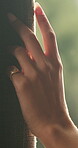 Hand, touching and woman in home with curtain, morning or view for decision or reflection. Contemplation, summer and thinking with person for feel, inspiration or perspective in modern apartment