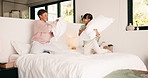 Playing, siblings and children with pillow fight in bedroom for bonding, playful fun and weekend. Family, happy and boy with girl on bed for laughing, energy and relationship in home for childhood