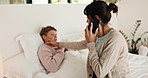 Phone call, sick and mom with boy in bed for concern with temperature, fever and symptoms. Family, home and mother with kid on cellphone for virus, infection and telehealth consultation for advice