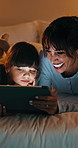Night, mother and girl in bedroom with tablet for online streaming, internet or cartoons together. Family, home and mom with child on digital tech for entertainment, videos and bonding on weekend