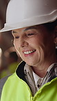 Smile, woman and engineer talking at construction site, thinking and safety maintenance feedback. Mature person, architect and happy for inspection, building development and planning with flare