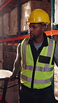 Logistics, walking and man with pallet jack in warehouse, stock export and storage for cargo delivery. Inspection, transport and black person with shipment for distribution, trolley and supply chain