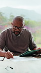 Black man, tablet and writing for budget in home with review, paperwork and glasses for bills in morning. Person, tech and documents with taxes, fintech and app with asset management at apartment
