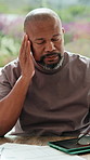 Finance, man and glasses with headache in home for debt overload, budget stress and massage. Mature black person, eyewear and migraine for financial anxiety, missed bills and overwhelmed by expenses